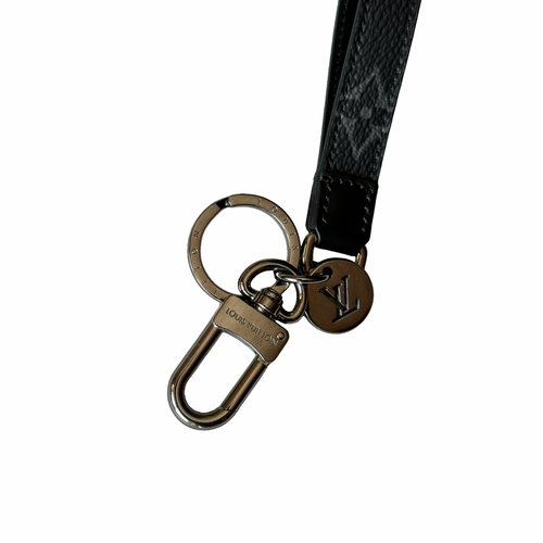 Louis Vuitton keychain with black strap on a white background